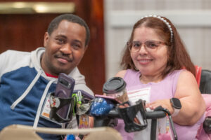 A man and a woman sit next to each other at DD Day.